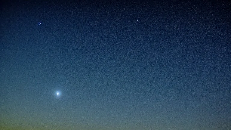 Comet in the night sky over the plain