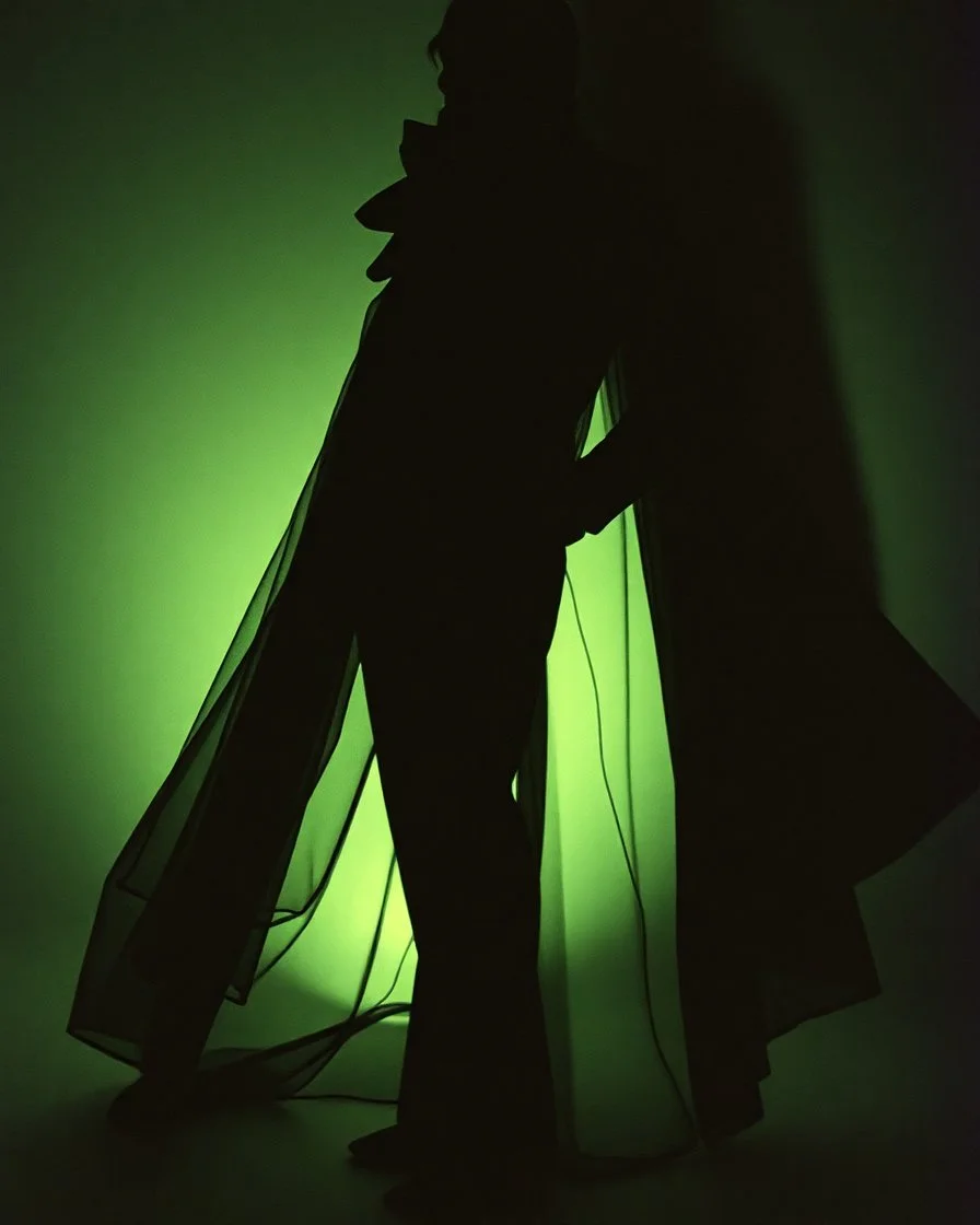 mysterious man, the man from shadow, Paolo Roversi for a vogue magazine, fashion editorial 1995, full length, paper magazine style, model wearing YSL, dinamic pose, holographic