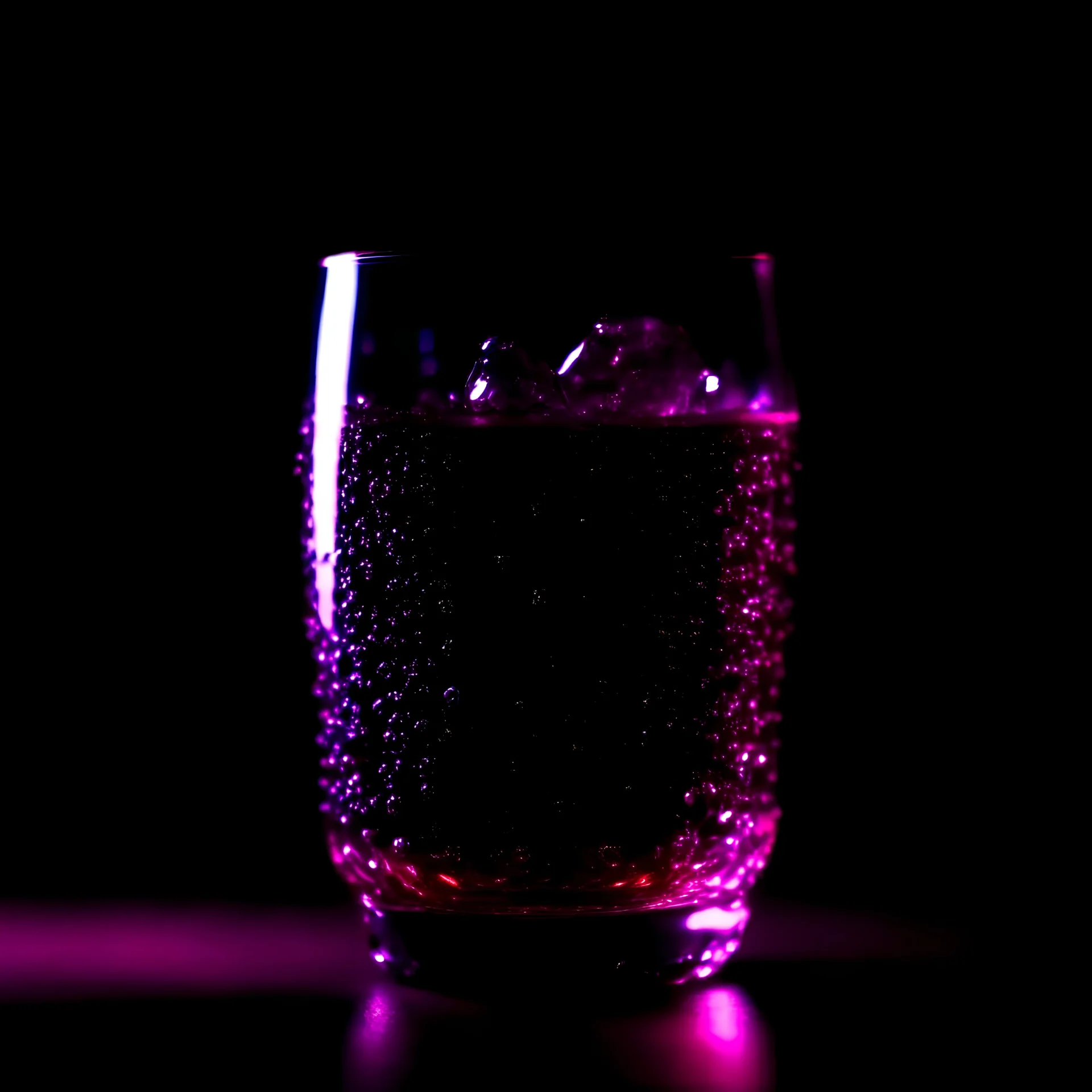 Dark purple soft drink full of bubbles, in a very futuristic glass glass, with ice cubes, on a dark purple background