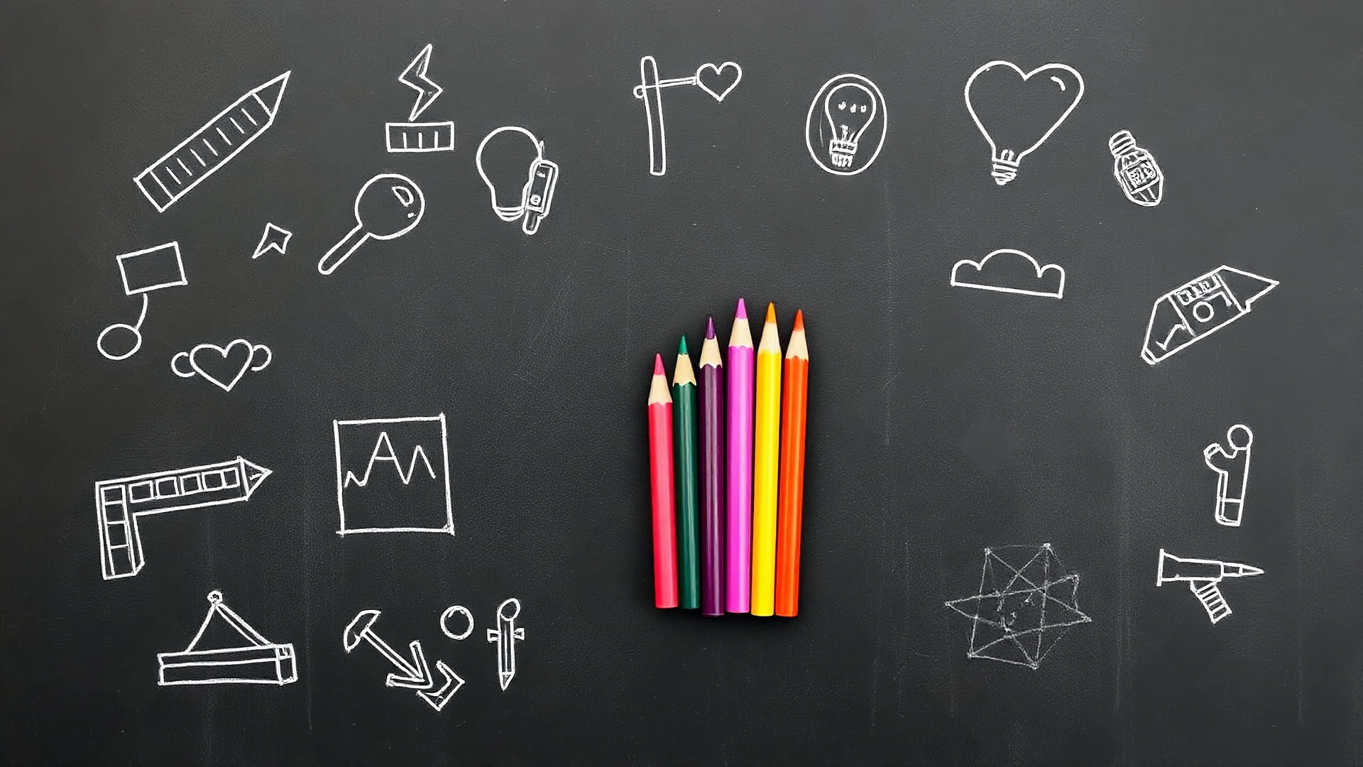 A blackboard sketch with a bunch of colored pencils in the middle of the image