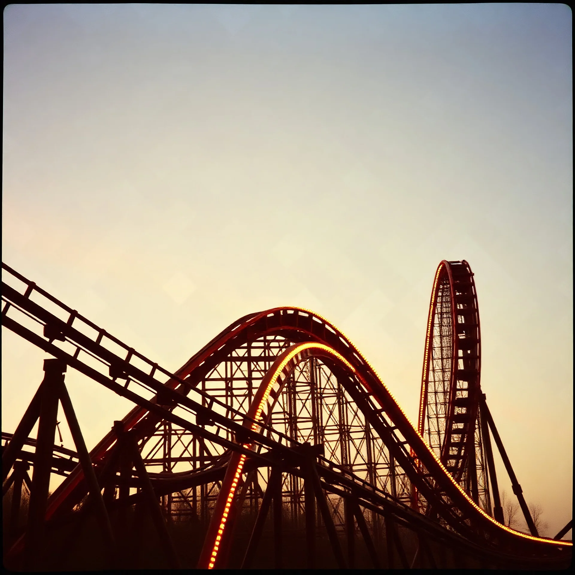 kodachrome of a roller coaster, evening light, relaxing, vintage