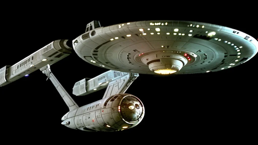 a screen capture from a star trek movie of a battle-damaged starship enterprise IN the year 2380 IS IN A BATTLE with monster ufos sci-fi meticulous, highly-polished, photorealistic, studio production, intricately detailed, GALACTIC, directed by gene Roddenberry,