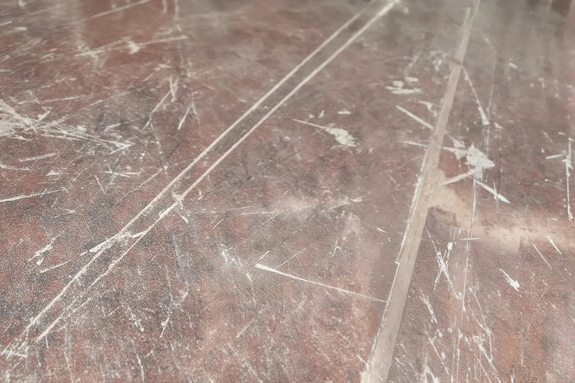 scratched garage floor, from very low perspective