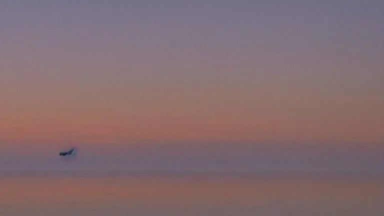 evening calm atmosphere and solitude, lake + moon, on the horizon + a lot of wind