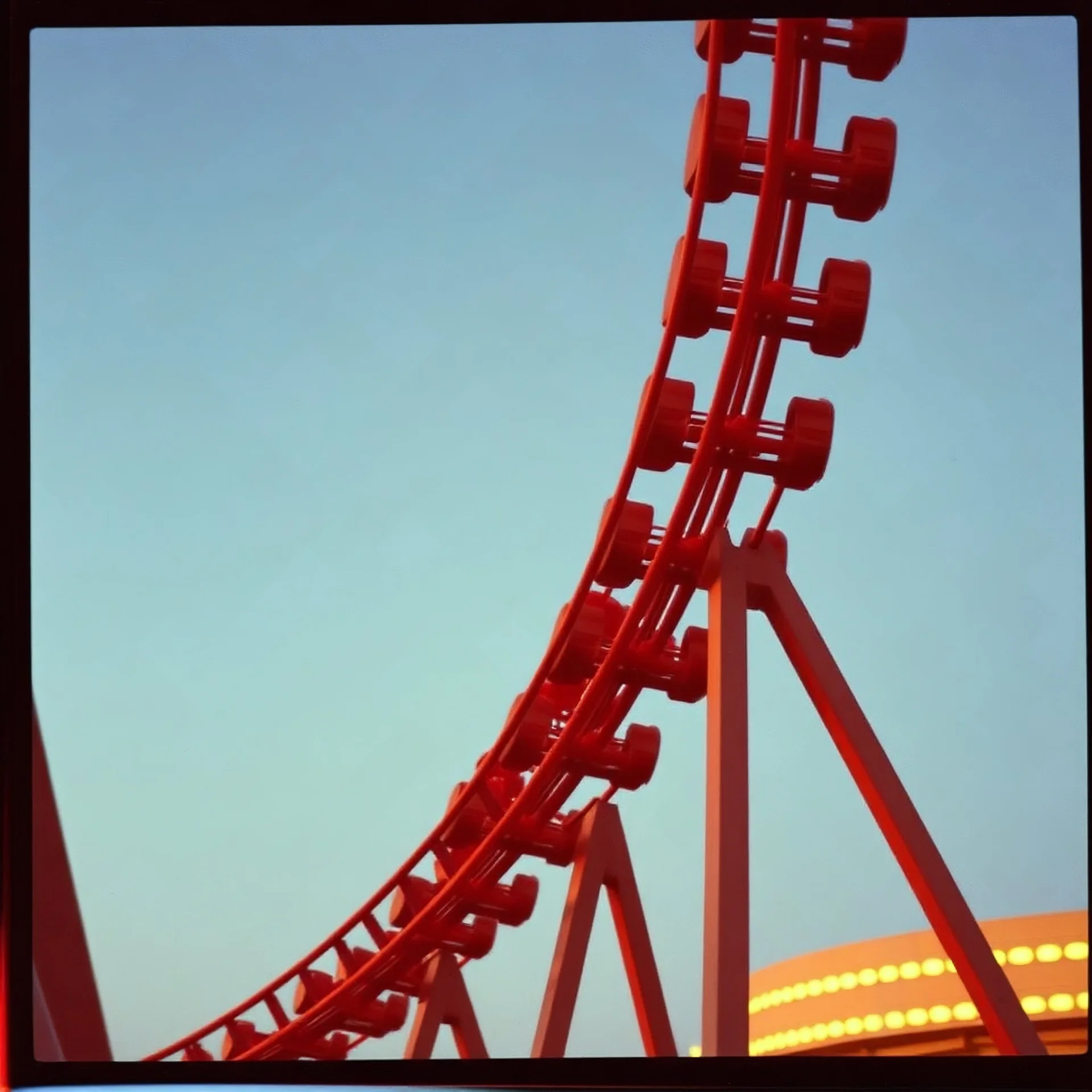 kodachrome of a roller coaster, evening light, ralaxing, vintage