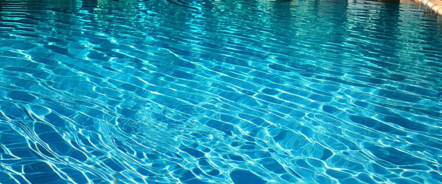 the rippled surface of the water in a pool, just the water