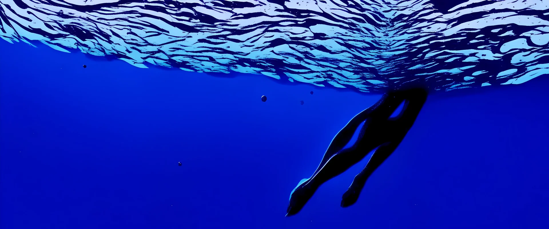 a human reaching the surface of the ocean