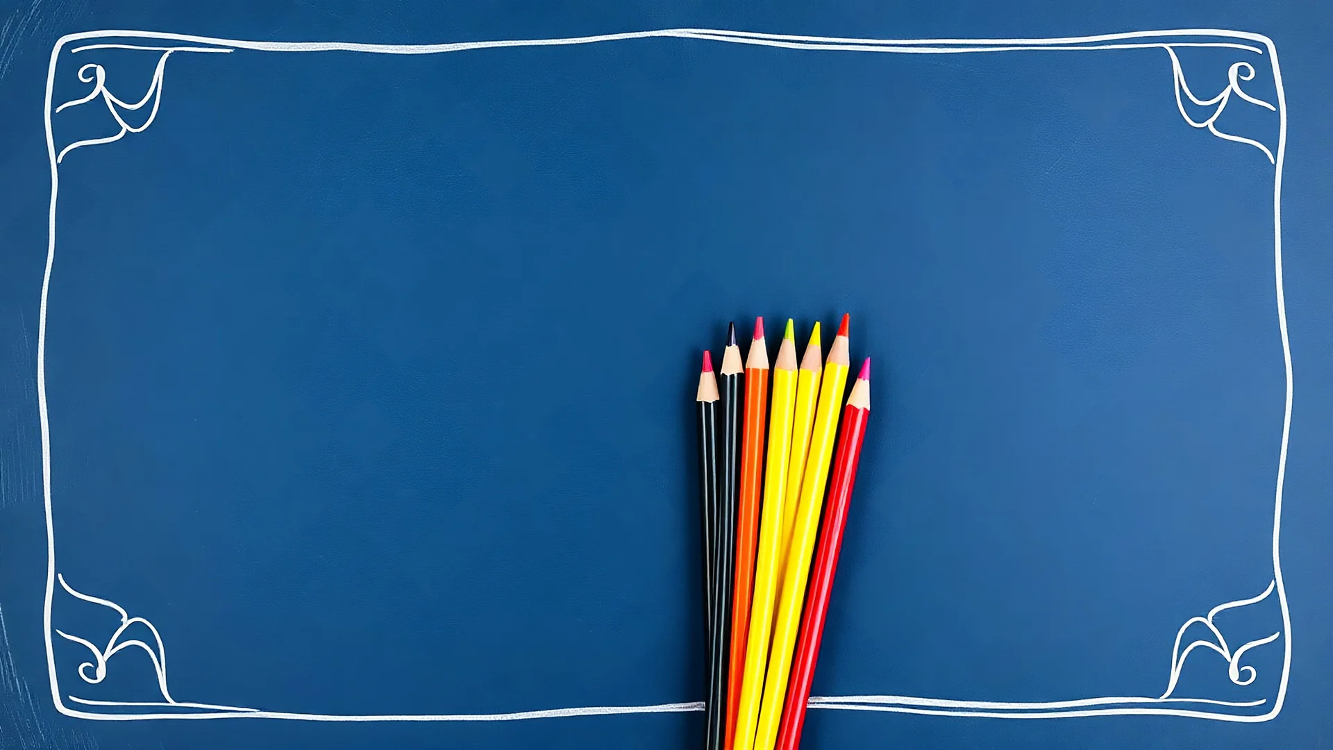 Blackboard design with a bunch of colored pencils in the middle of the image on a blue background