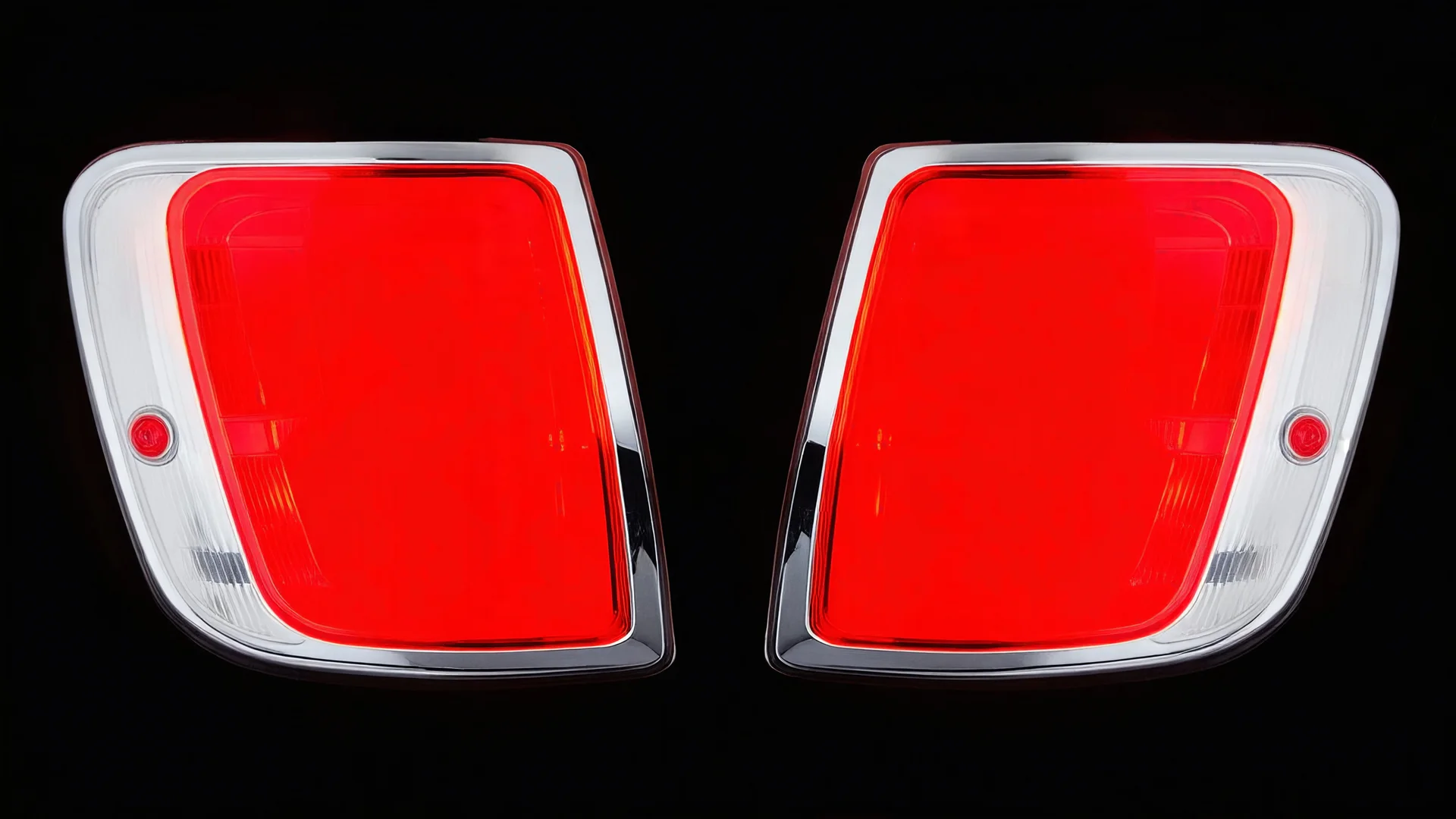 2 vehicle taillight(with chrome trim) on black background, add details and inner glow
