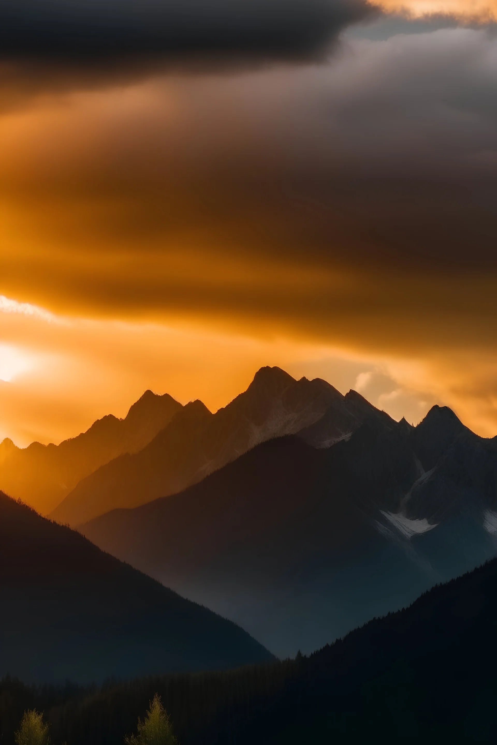 Sun setting over a cloudy mountain range