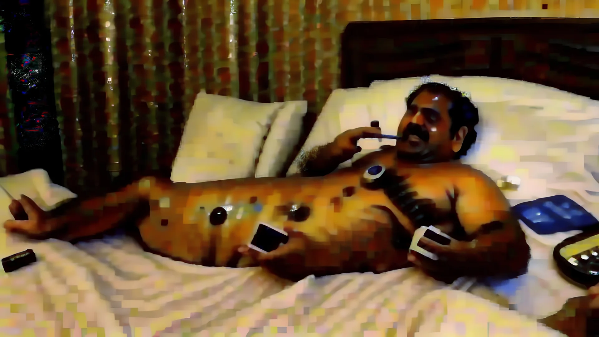 indian hotel keeper massages his belly button while drunk on the phone