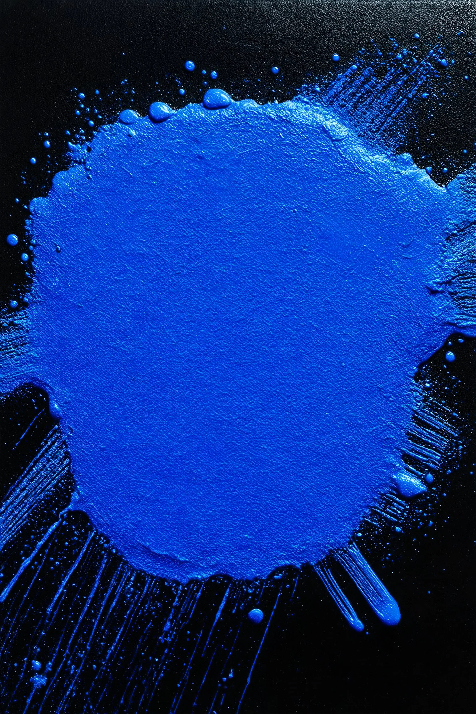 Blue paint spread on blck background