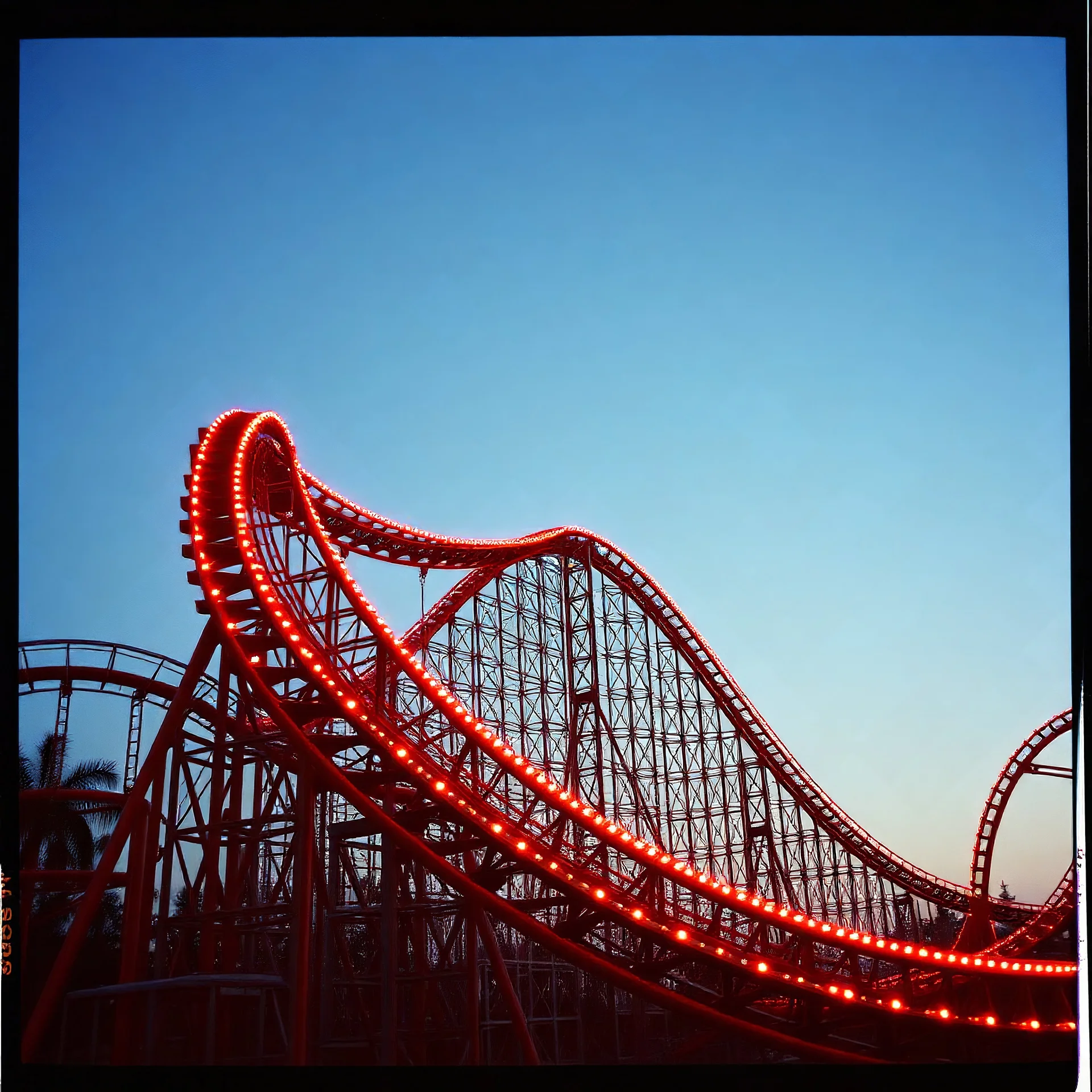 kodachrome of a roller coaster, evening light, ralaxing