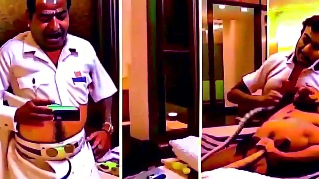 indian hotel keeper massages his belly button while drunk on the phone