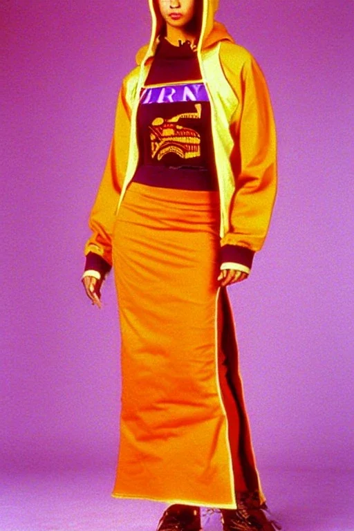 year 1996 fashion. Straight skirt, low waist. Combat hoodie with long tippet, which continues to the hood. Colors: denim blue, blue, purple, cream, khaki, "pastel green", lilac, plum, orange, terracotta, red, light yellow, pink, dark blue, beige. Latex in small part. Sturgeons vulgarism pattern prints.. Bridget Jones, Missy Elliot, Jennifer Lopez. Karjalainen kuvio, Karjala patterns tradiotional. Hat with a visor, integrated to AKG-style headphones.