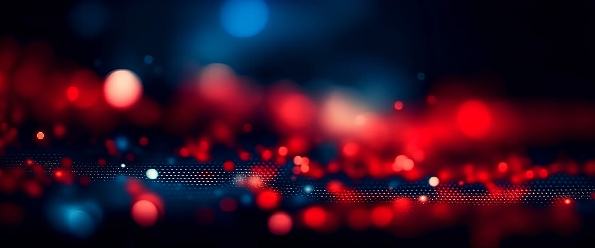 Abstract festive blurred background with beautiful glowing particles and round bokeh. Dark evening blue and red background for christmas or party.
