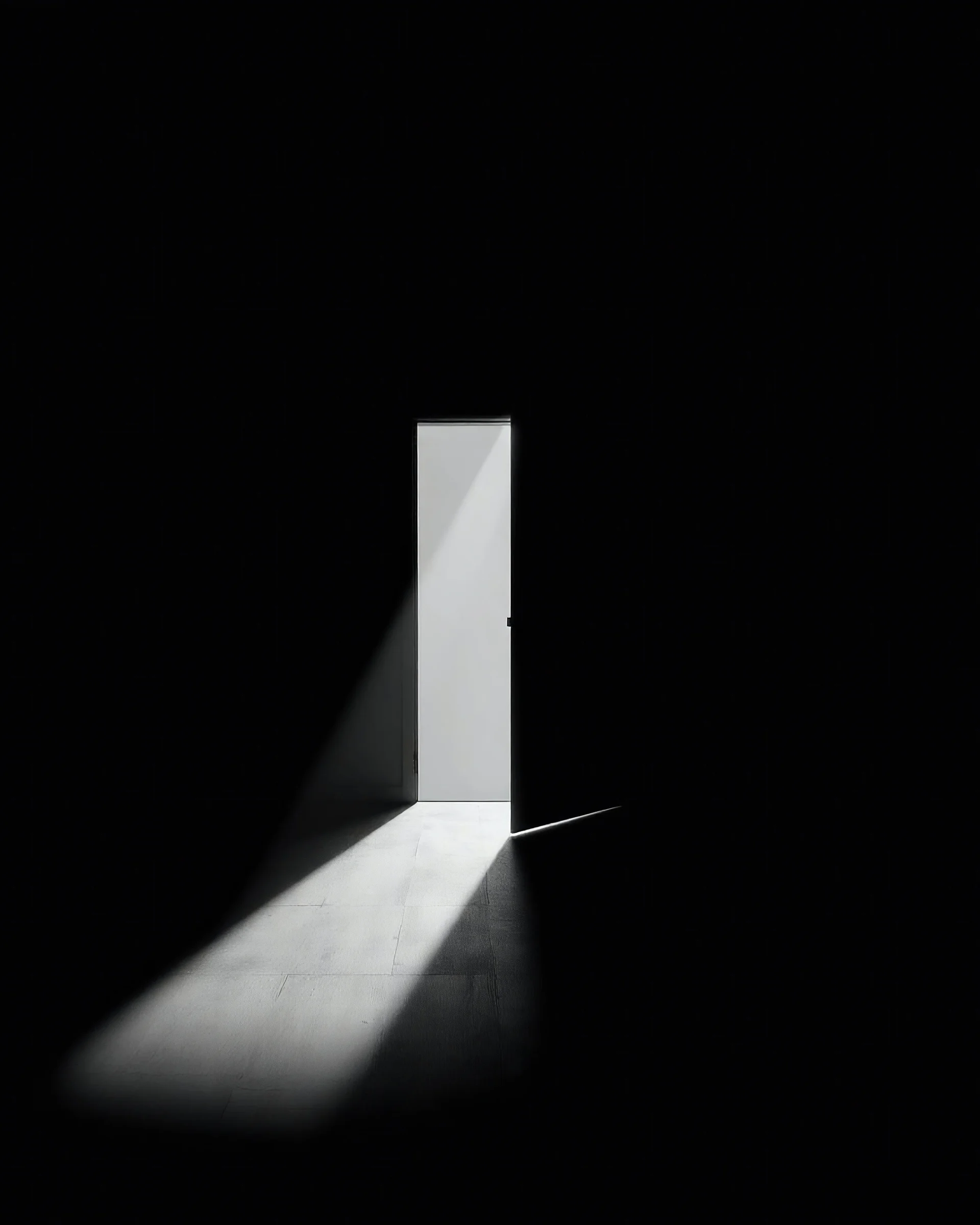 In a dark room, light streams in through an open door symbolizing new possibilities, hope, and overcoming problems.