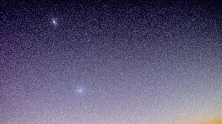 Comet in the night sky over the plain