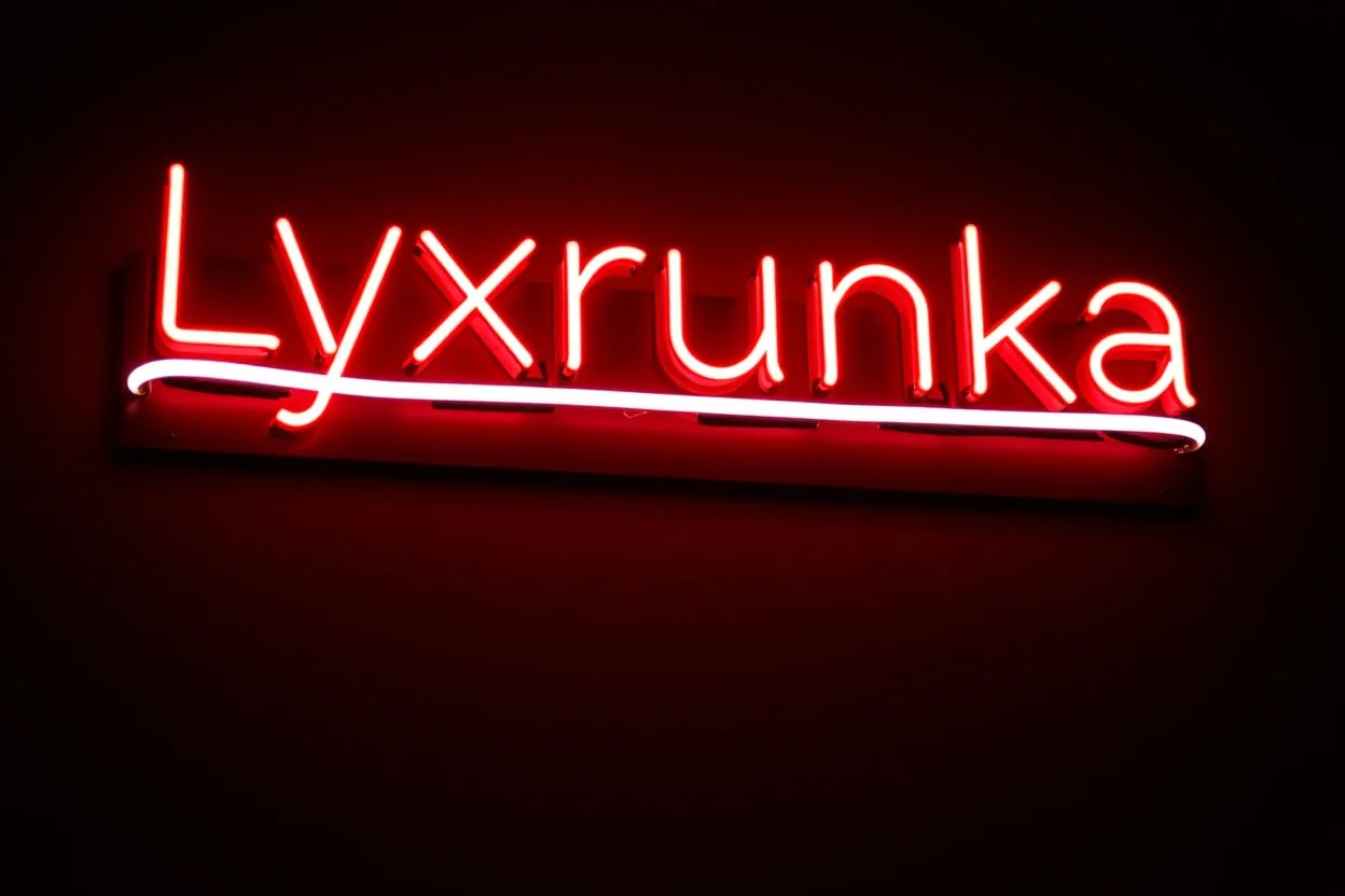 A simple neon sign labeled "Lyxrunka" black background and bold red font