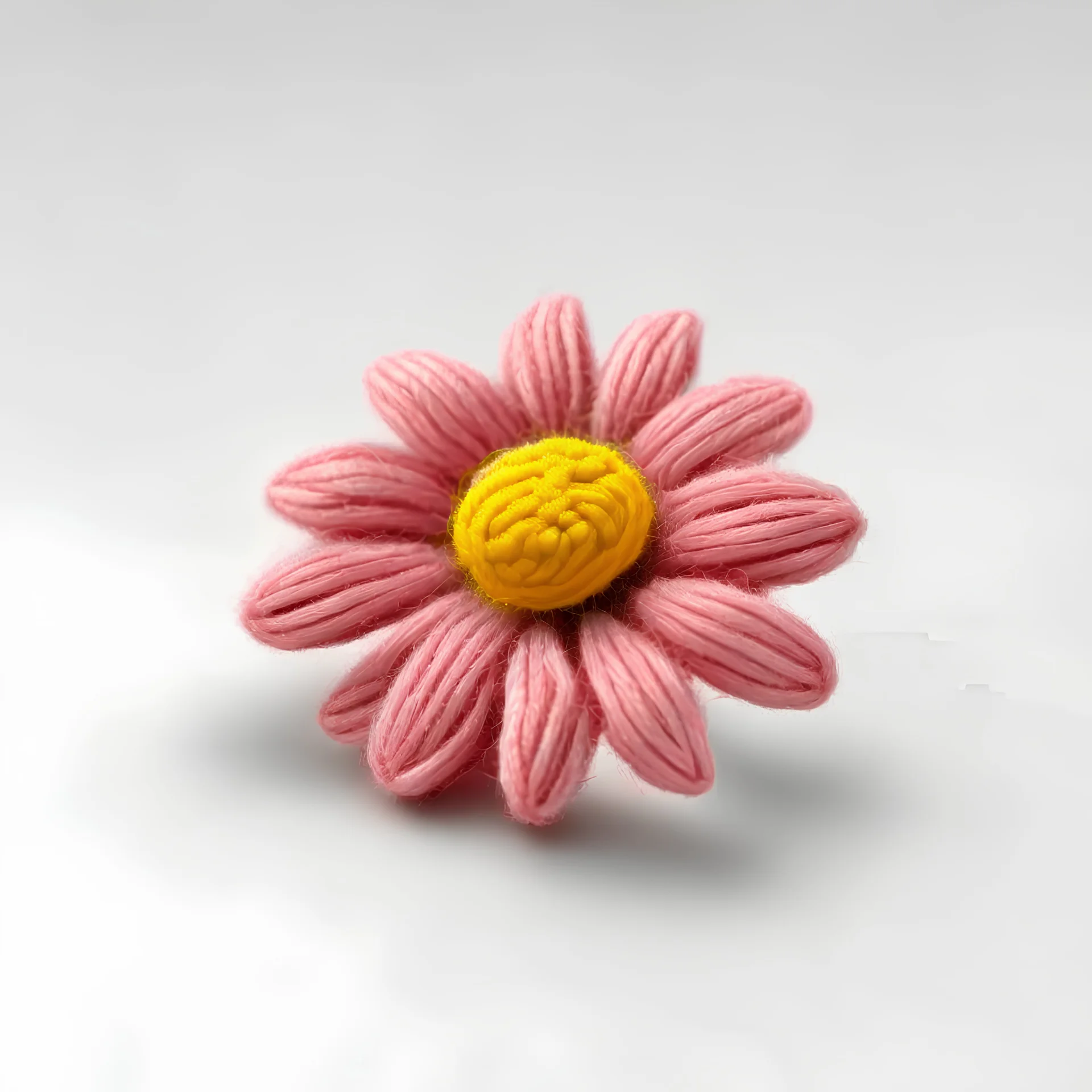 Wool bobbin shaped like a pink daisy flower. front view. bottomless.