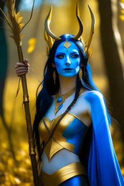 A picture of a beautiful blue faced indian goddess with skin painted blue, blue painted body, blue painted torso, wild black hair, stag antlers, elven ears, golden skirt, holding a staff in a sunny forrest