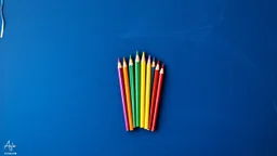 Blackboard design with a bunch of colored pencils in the middle of the image with a blue color theme on a blue background
