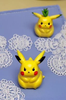 cute and nice faced marzipan Pikachu on a lace blanket on a kitchen table