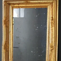 A 4K painting of A long ornate gold mirror. The mirror is fractured and broken into 100 symmetrical pieces