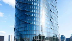 A sleek, cylindrical skyscraper featuring large, elliptical windows that curve along the building's surface. The reflective glass creates the illusion of movement as the windows stretch and warp around the tower, creating a dynamic, organic form. The building's smooth, uninterrupted curve contrasts with the angular city skyline. Award-winning photograph.