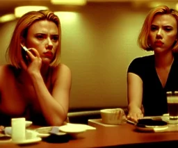 Scarlett Johansson in Lost in Translation, at the counter of a hotel bar, staring into space and smoking.