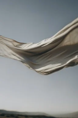 a piece of fabric flying in the air