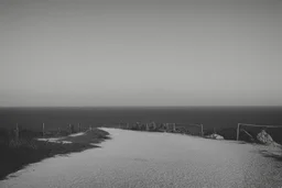 walking along a path that winds towards the top of a mountain, it is summer, the sea in the background photography taken with a Leica camera and 50mm lens, real photography in black and white, nostalgia