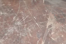 scratched garage floor, from very low perspective