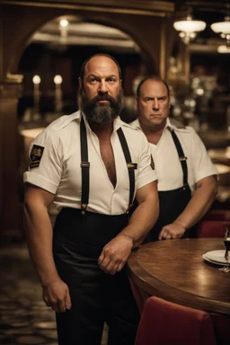 half figure shot photography of a 42 years old serious sicilian waiter in uniform, similar to Bud Spencer, shaved hair, muscular bearded strong chubby man with hands in the pockets, in an elegant empty restaurant, bulge, bullneck, manly chest, unshaved, short hair, photorealistic, dim light , side light, view from the ground