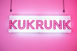 A 1980 disco sign labeled "KUKRUNK" white background and bold 80s font