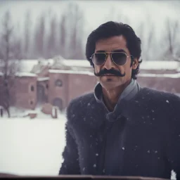 a man wearing sunglasses standing in the snow, price of persia movie, grainy footage, prison background, mustache, color grade, organ harvesting, man in adidas tracksuit, mahmud barzanji, frames, old wool suit, 8 0 s camera, thick mustache