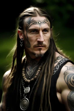 clean shaven middle aged long haired celtic warrior with tribal tattoos