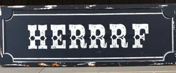 large and wide hand painted old western sign that reads: "SHERRIF" white on black with inset boarder stripe in white aged
