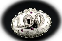 a silver egg in the style of Alma Pihl – that says 100 on it decorated in gems glorious beautiful