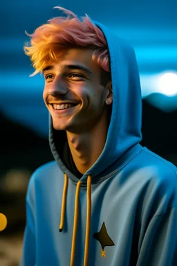 A young man with tousled pink hair and golden eyes floating among the stars wearing a light blue hoodie and black board shorts. He is smiling softly and holding a star in one hand.