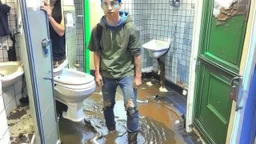 sewage floods bathroom and hallway because of boys playing with clogged toilet. One russian man stands on the sink