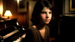 In a dark room a 16 year old girl who looks like young Julia Ormond with smooth short bob cut and bangs. She is playing on piano in a new year party.