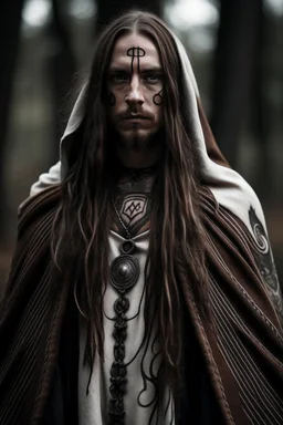 long haired warrior with tribal tattoos and cloak