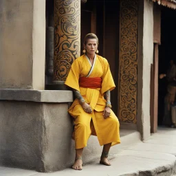 [very impressive high res masterpiece in Kodak Eastman 5247, bokeh scene by Stanley Kubrick] Elizabeth Montgomery, the Shaolin gangsta monk covered by tattoos, waiting outside in a yellow kimono on a stone doorstep. Her presence is striking, the tattoos on her knuckles adding to her intimidating aura. With a fierce glare, she menaces the camera with her two fists, each knuckle etched with intricate designs symbolizing her journey and battles fought.