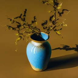 artistic photo of a tiny cracked ceramic vase repaired with gold, kintsugi, garden setting, beautiful landscape photography, beautiful, vines and leaves, delicate, cinematic, high detail, beautiful composition, delicate arrangement, aesthetic, soft lighting, award winning photography, tender