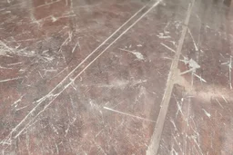 scratched garage floor, from very low perspective