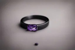 небольшое чёрное кольцо с лиловым камнем выпало на пол.