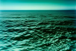 A greenish blue cold ocean with small glaciers painted by Andy Warhol