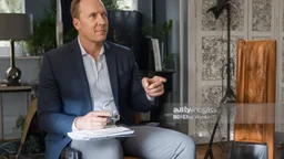 alex sits far away from miserable wife on broken couch