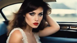 [artistic photo by Tony Kent (1980)] a brunette in a car bends over to look at the camera, she is going to a party, she has a cigarette